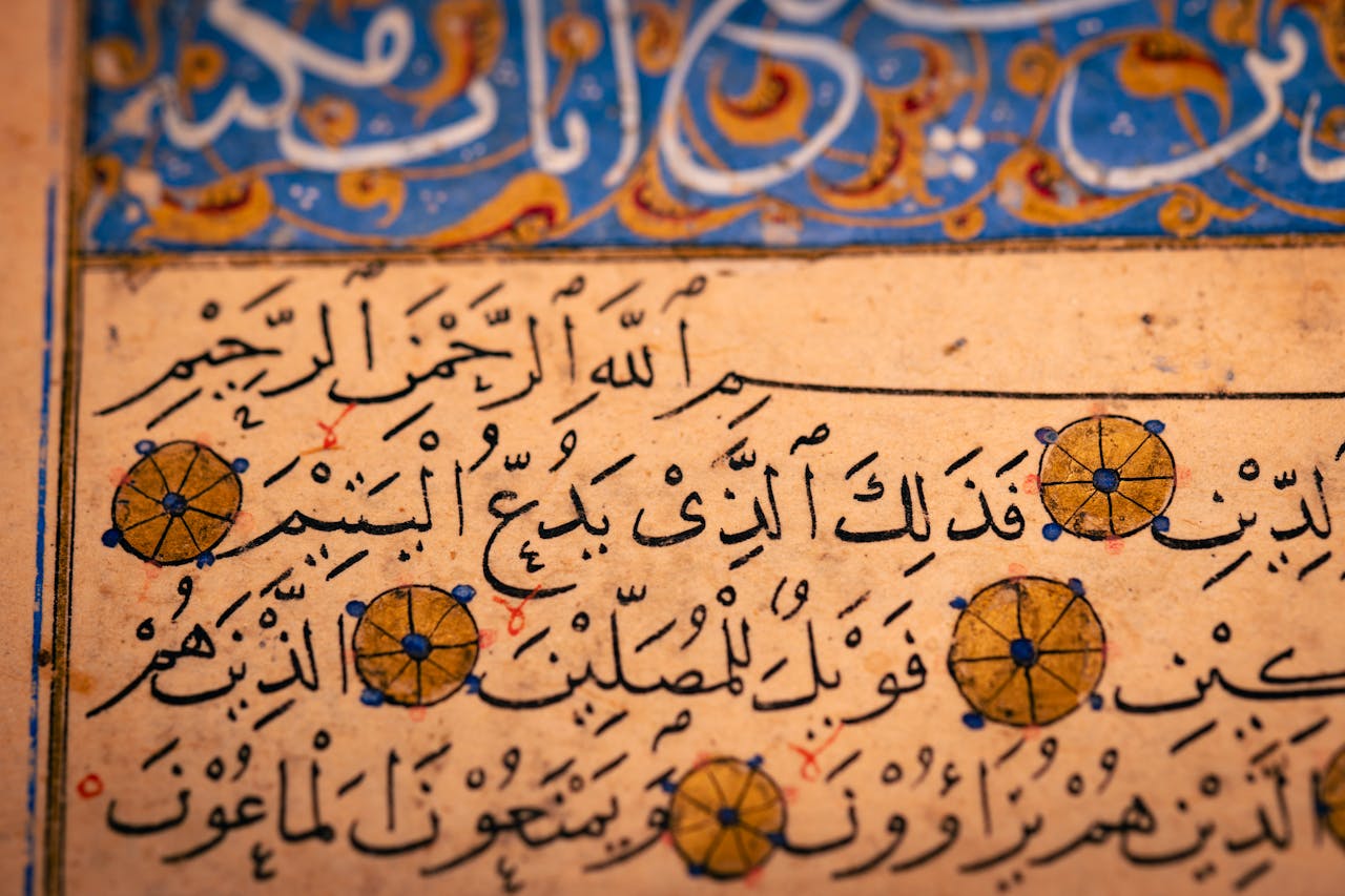 gallery-3 Detailed image of ancient Arabic calligraphy with decorative elements.